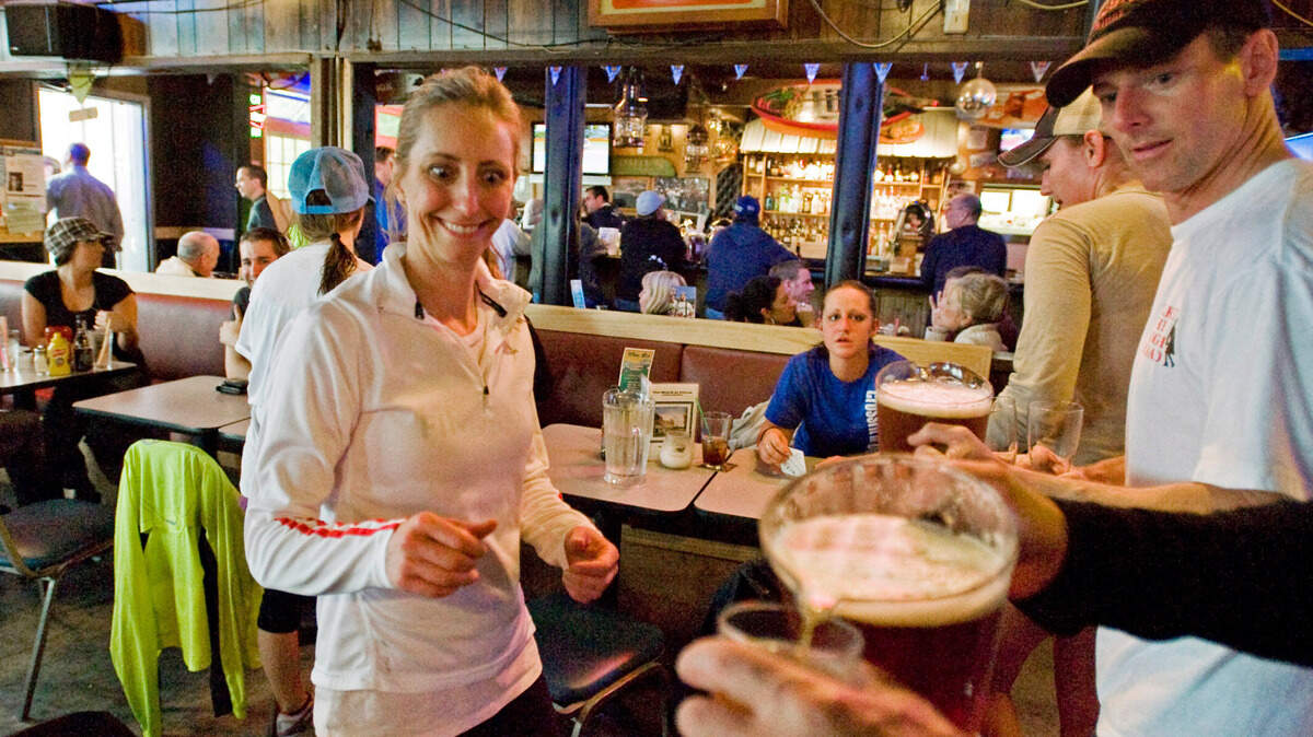JoAnne Richards readies for the second half of the evenings activities, in The Beach Tavern on May 20, 2010. A decade later, Tacoma Runners is eagerly anticipating its return after the COVID-19 pandemic shut it down last year.