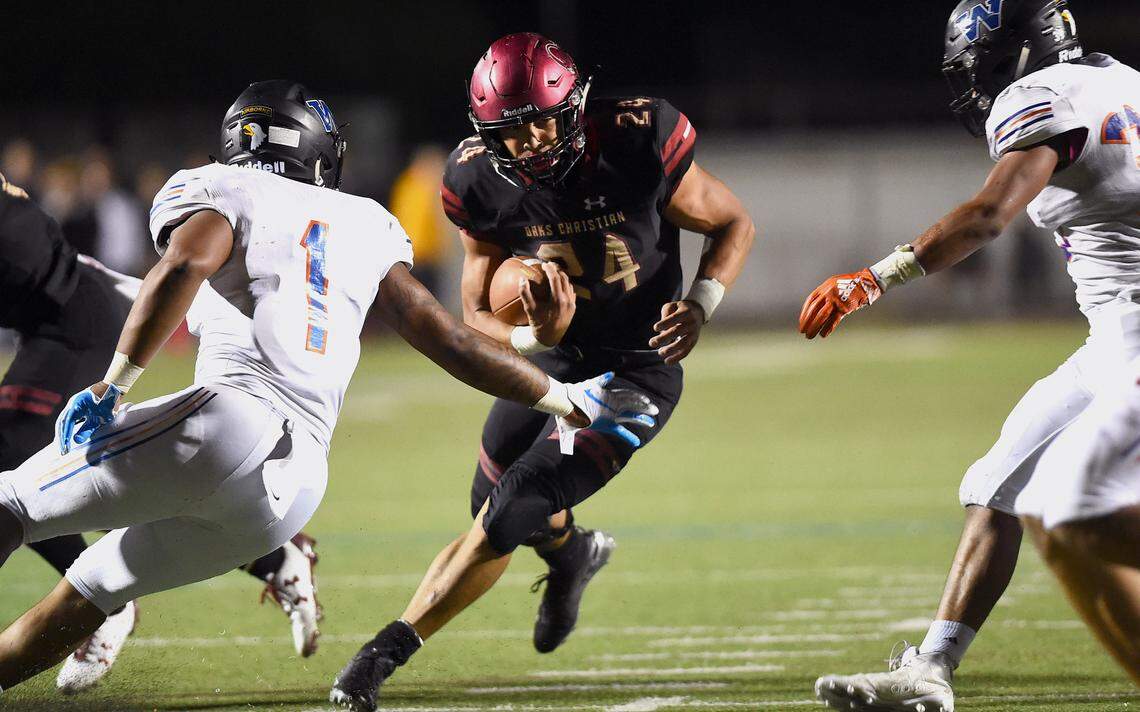 Zach Charbonnet carries the ball for Oaks Christian during their Marmonte League matchup against Westlake Friday night.(photo by Andy Holzman)