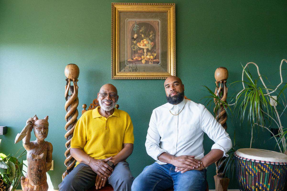 Father and son, Leon Walker, left, and Rob Young, sit together in Walker’s home on Monday, June 9, 2025, in Tacoma, Wash. The pair will perform “Said By The Father and Son,” a blend of live hip hop, soul and gospel music and spoken poetry, at the Spanish Ballroom at Tacoma’s McMenamins Elks Temple on June 15.