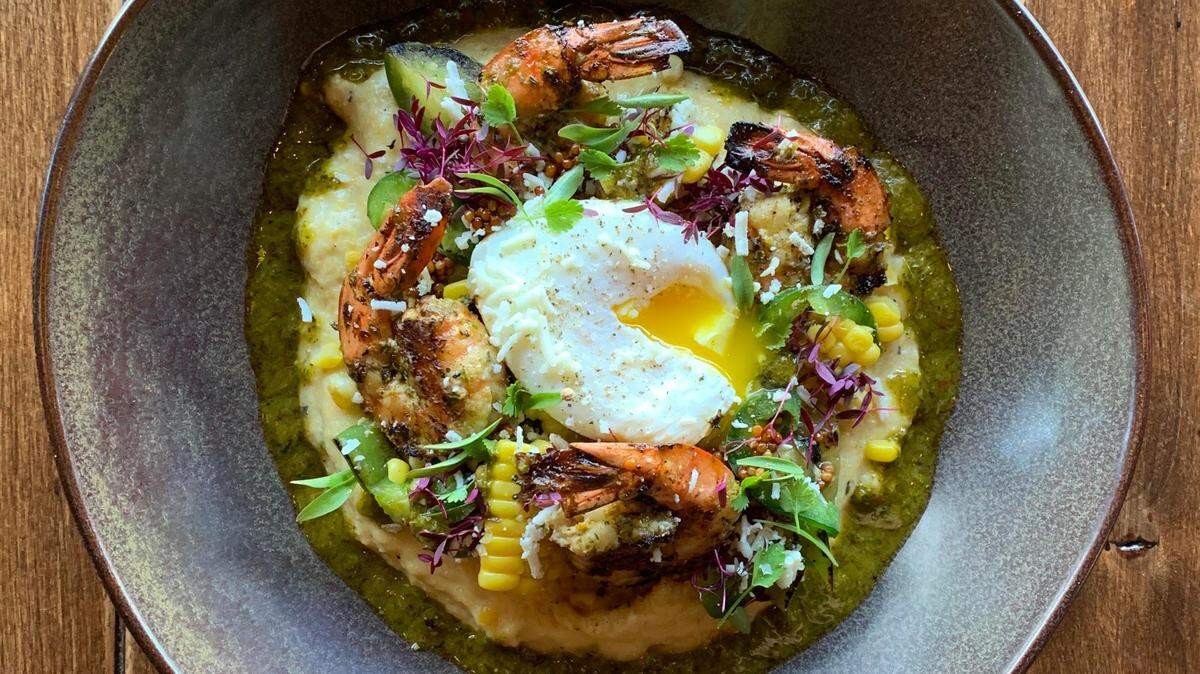 Asado adds signature Argentine flair to its new brunch menu, debuting this week. Here, the Camarones y Semola: grilled prawns and a poached egg atop a creamy polenta with tomatillo, cotija, pickled jalapenos and chimichurri.