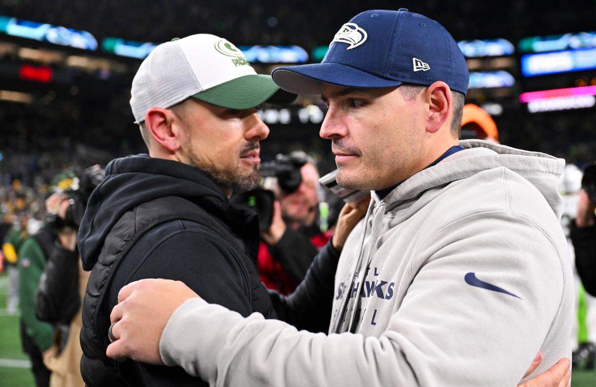 Green Bay Packers head coach Matt Lafleur and Seattle Seahawks head coach Mike Macdonald hug after the Green Bay Packers 30-13 victory at Lumen Field, on Sunday, Dec. 15, 2024, in Seattle, Wash.