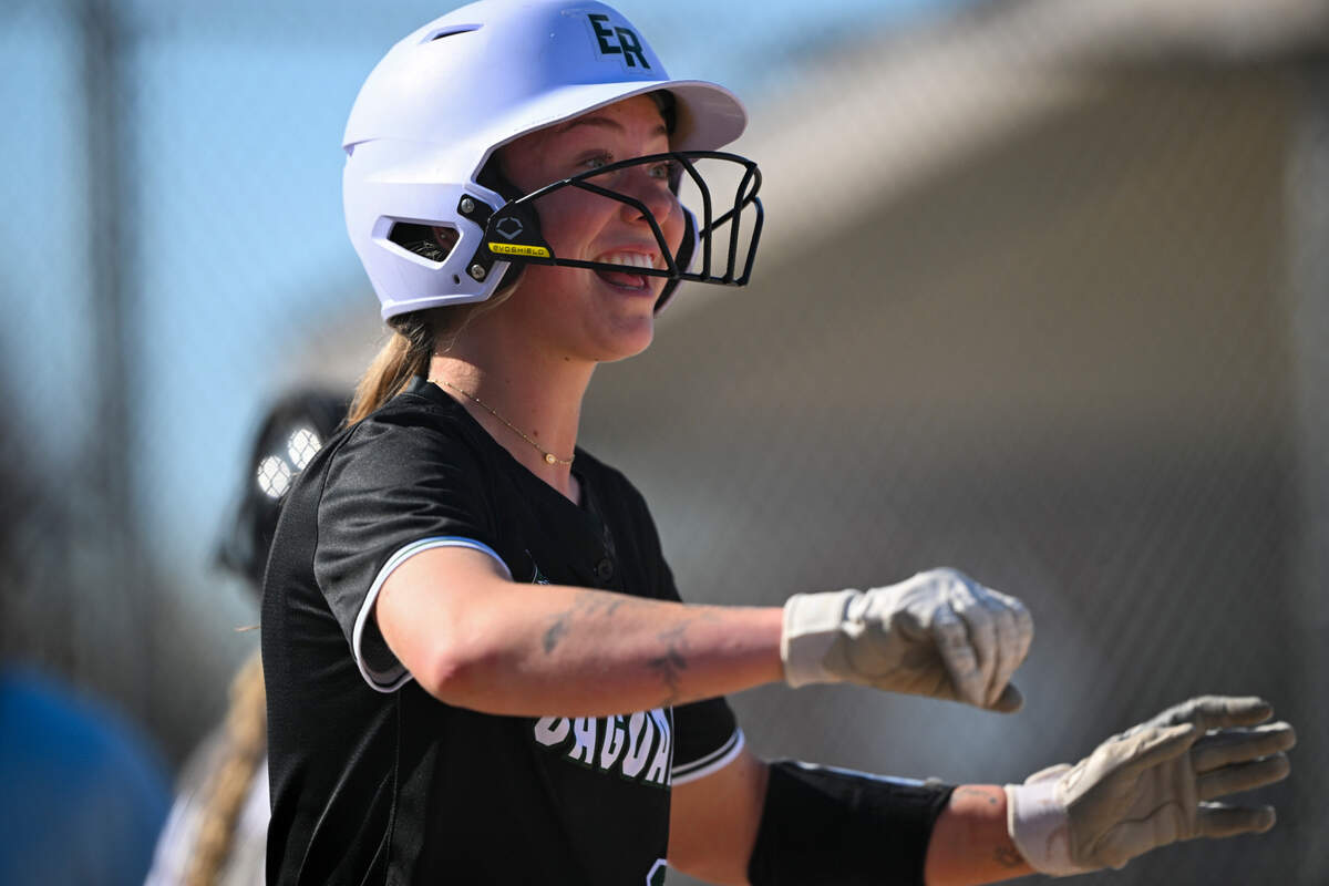 Emerald Ridge’s Abygale Redwine (22) reacts to scoring a run off a sacrifice bunt during the softball game at Puyallup High School, on Friday, April 18, 2025, in Puyallup, Wash.