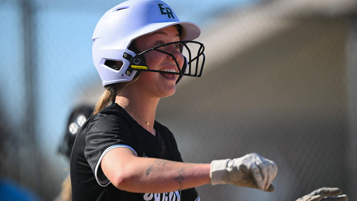 Emerald Ridge’s Abygale Redwine (22) reacts to scoring a run off a sacrifice bunt during the softball game at Puyallup High School, on Friday, April 18, 2025, in Puyallup, Wash.