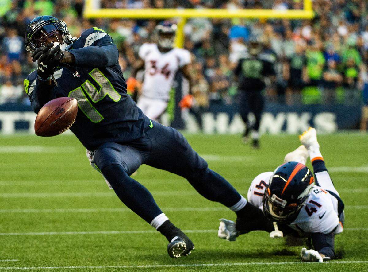 Seattle Seahawks wide receiver D.K. Metcalf (14) can’t pull down a catch in the second quarter. The Seattle Seahawks played the Denver Broncos in a NFL preseason game at CenturyLink Field in Seattle, Wash., on Thursday, Aug. 8, 2019.