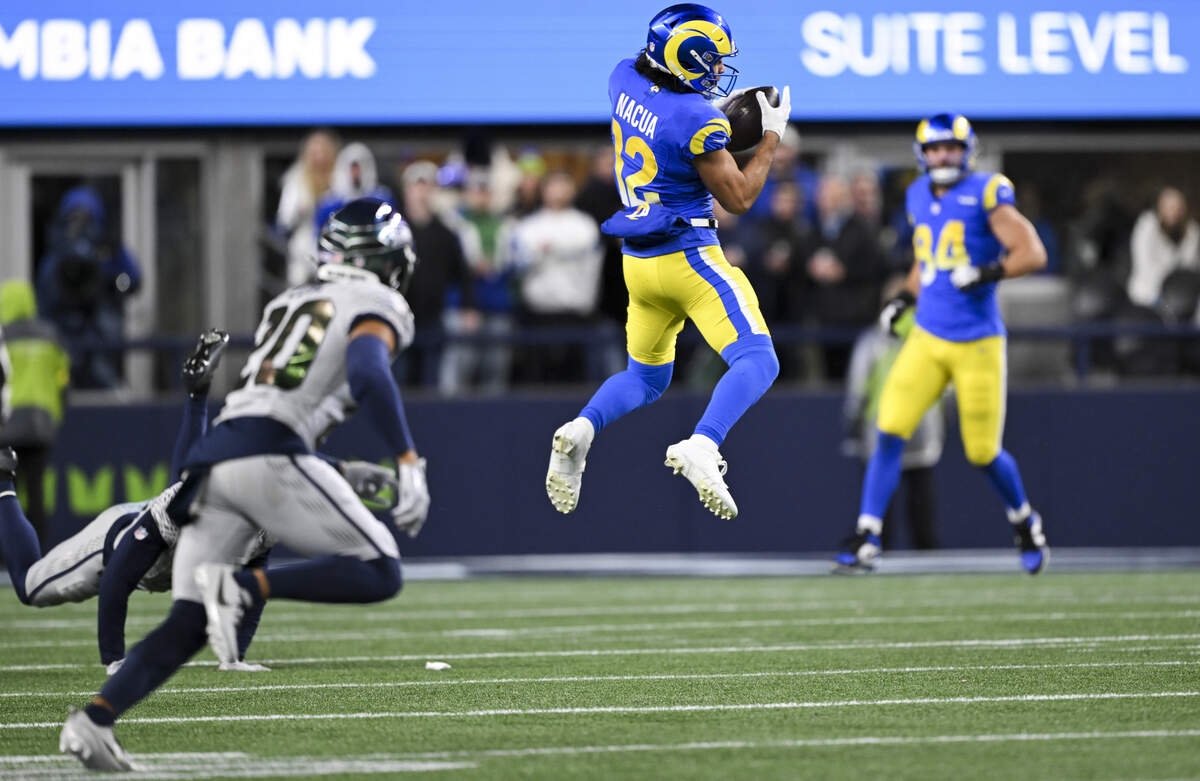 Los Angeles Rams wide receiver Puka Nacua (12) makes a catch against the Seattle Seahawks during the first quarter of the game at Lumen Field, on Thursday, Dec. 18, 2025, in Seattle.