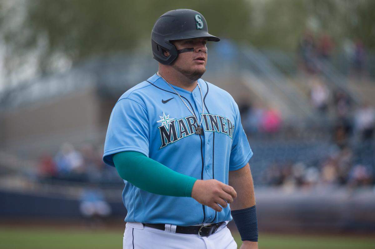 Seattle Mariners designated hitter Daniel Vogelbach walks back to the dugout at the end of an inning in a spring training game against the Rockies on Monday, March 2, 2020 at Peoria Stadium in Peoria, Ariz.