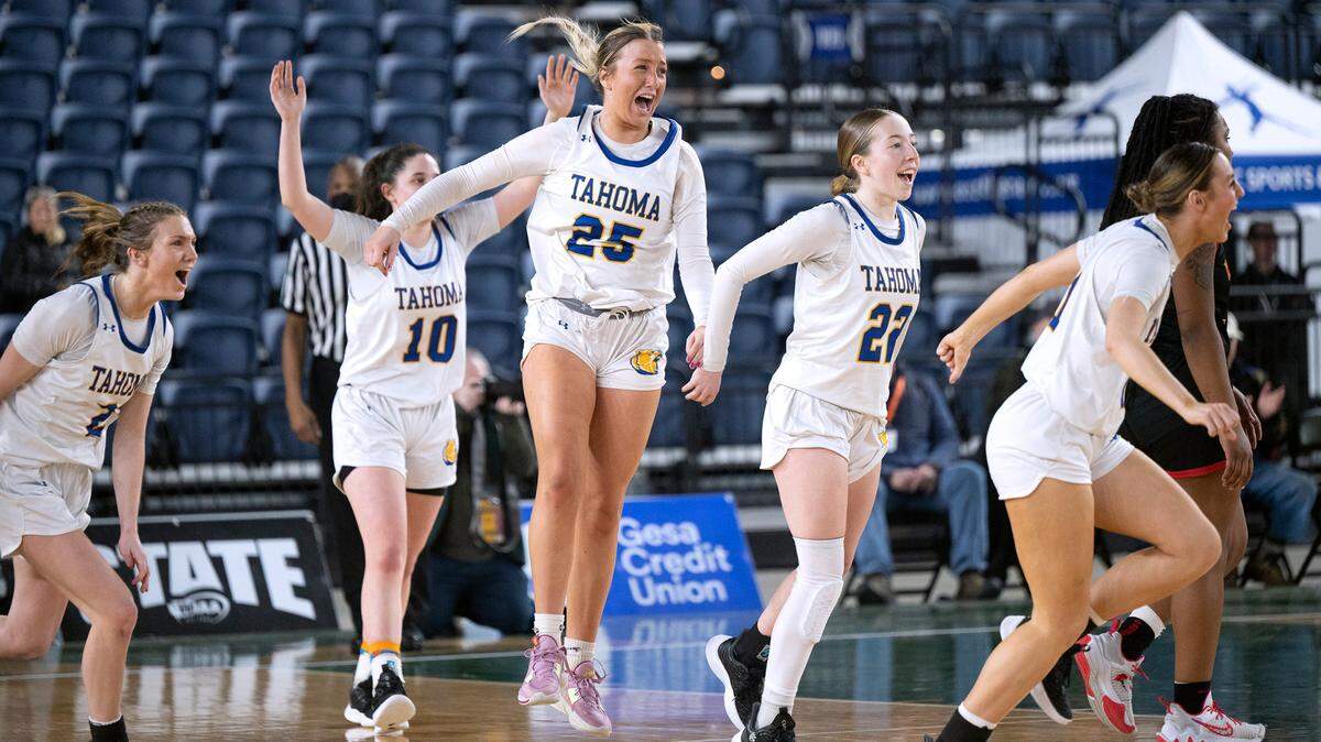 Tahoma’s Amelie Sitterud (25) and her Bear teammates celebrate their 61-57 victory over the Kamiakin Braves the 4A girls state third-place game at the WIAA state basketball tournament in the Tacoma Dome in Tacoma, Washington, on Saturday, March 4, 2023.