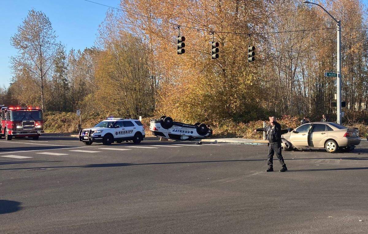 A Pierce County Sheriff’s Department deputy responding to a report of a domestic violence assault Thursday afternoon collided with another vehicle at an intersection near Parkland, causing the patrol car to roll onto its roof.