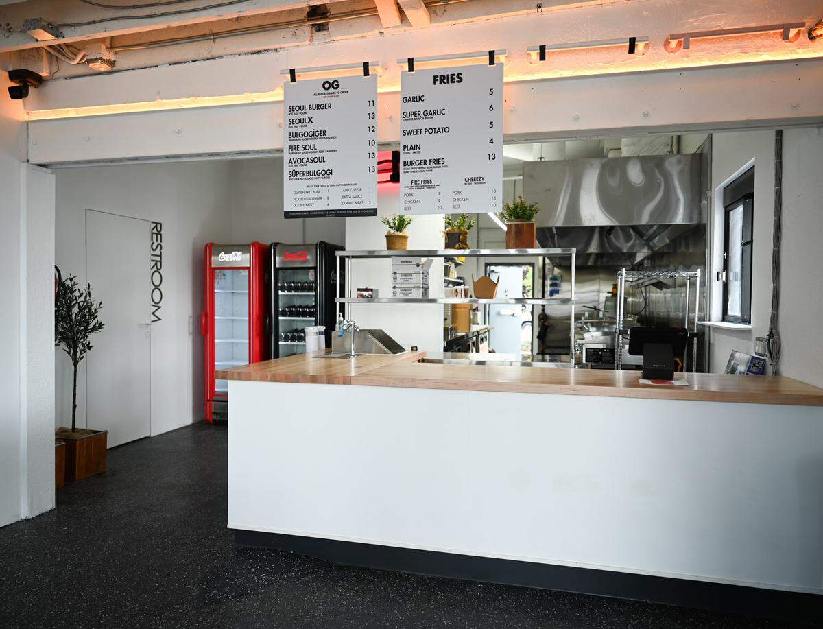 The new Burger Seoul has a big kitchen, meaning more burger styles and more fries are on the menu, with additional items coming soon. Owner Young La describes the aesthetic as “modern industrial.”