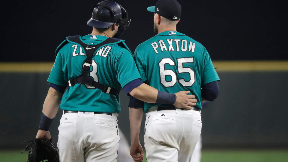 Seattle Mariners starting pitcher James Paxton (65) walks with catcher Mike Zunino at the start of the fifth inning of the team’s baseball game against the New York Yankees, Friday, Sept. 7, 2018, in Seattle. (AP Photo/Ted S. Warren)