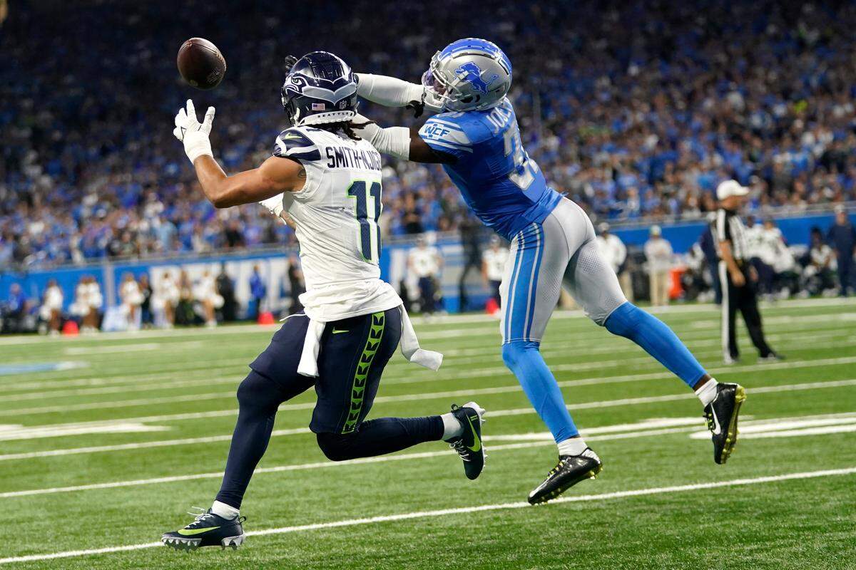 Detroit Lions safety Kerby Joseph (31) breaks up a pass intended for Seattle Seahawks wide receiver Jaxon Smith-Njigba (11) during the second half of an NFL football game, Sunday, Sept. 17, 2023, in Detroit. (AP Photo/Paul Sancya)