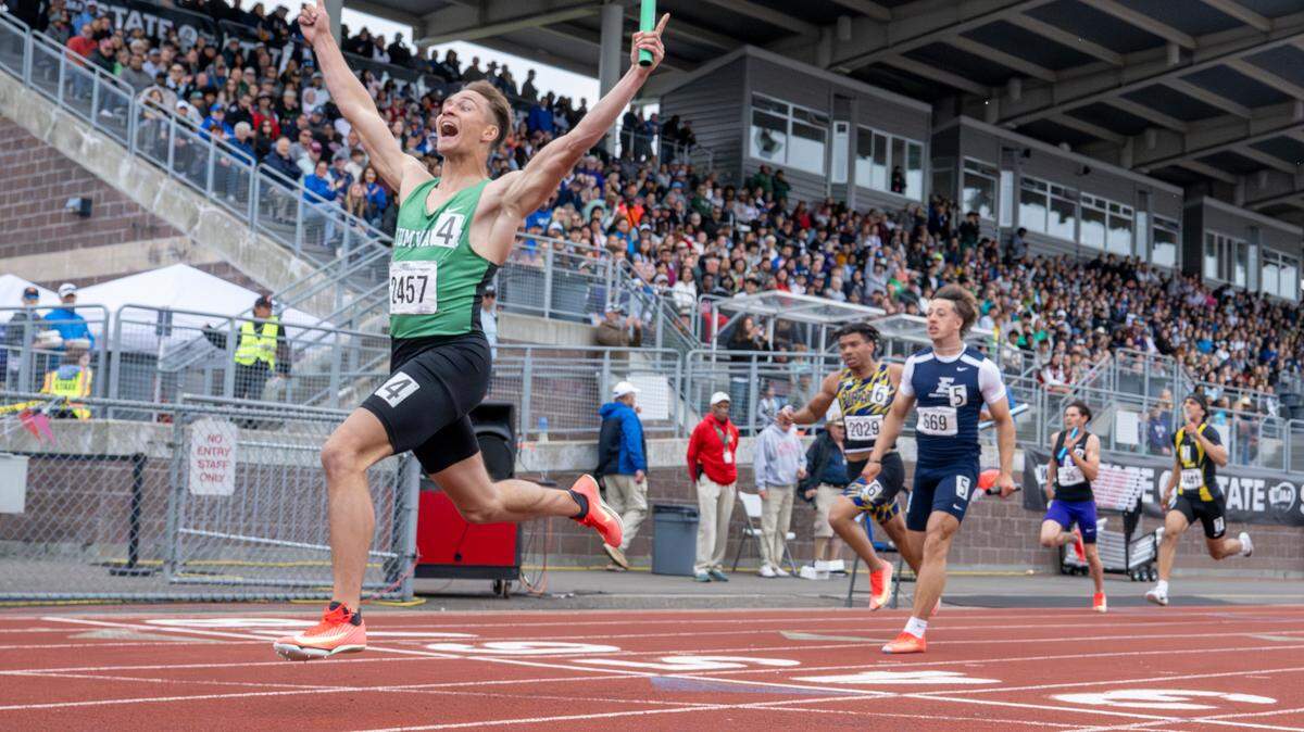 Tumwater’s Blake Kirkpatrick, left, the final leg in the 2A boys 4x100-meter relay final, raises his arms while crossing the finish line on Saturday, May 31, 2025, during the 2025 WIAA Track & Field Championships at Mount Tahoma High School in Tacoma, Wash. The team’s first place run was 41.78 seconds.