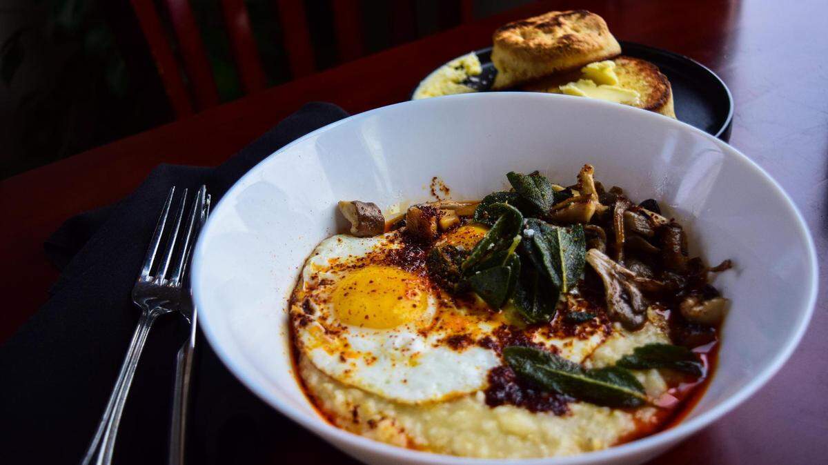 Anna Gonzales and her father Edward opened a second 3uilt Tacoma at 1101 Tacoma Avenue South, with savory breakfast fare and similar sandwiches the original restaurant inside 7 Seas Brewing. A bowl of heirloom grits features mushrooms, crispy sage and mapo-chili oil, pictured here with a homemade buttermilk biscuit.