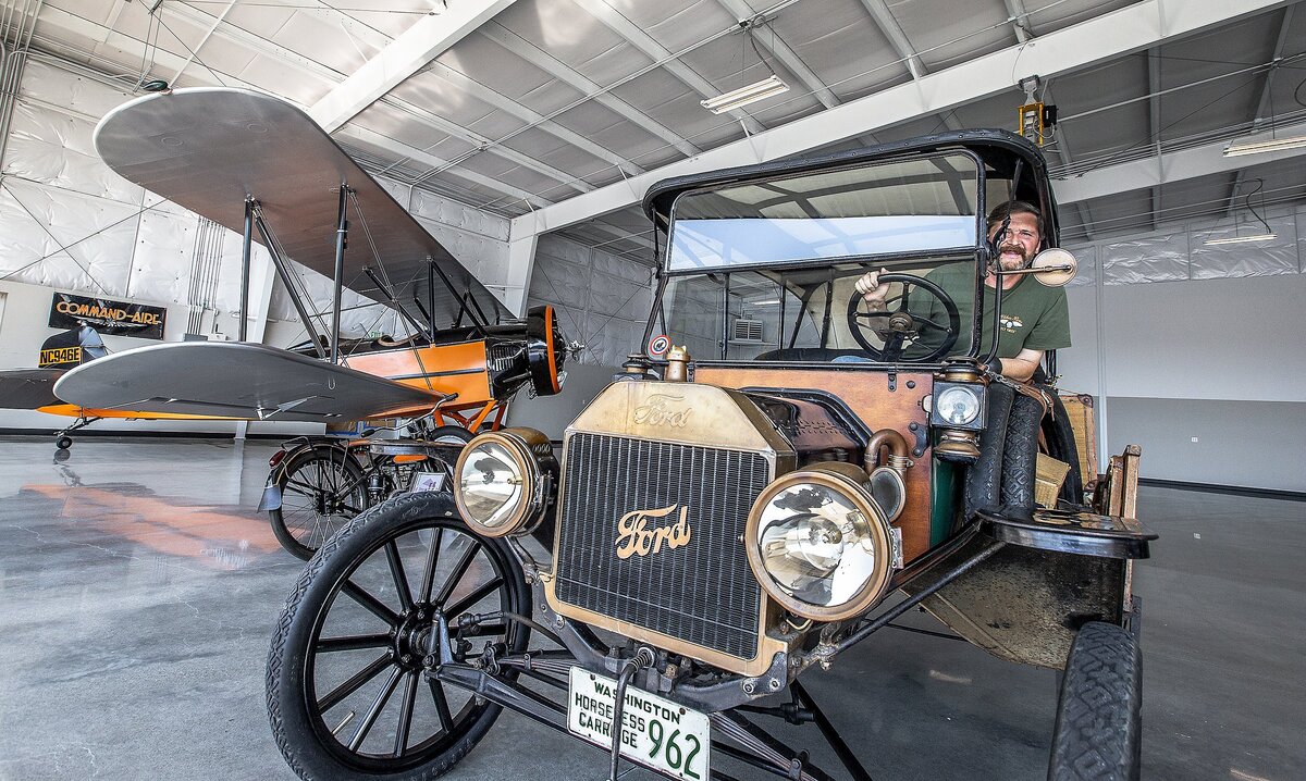 Bob Johnson in the driver seat of a 1914 Ford Model T. at the Tacoma Narrows Airport in Gig Harbor, Wash., Thursday, Aug. 9, 2018. Johnson said his father restored the car in Puyallup in the 1960s. Bob Juranich and Bob Johnson built antique planes for the last 30 years. Now, they have 15 of them and counting. Their work are on display in the Point Fosdick Antique Airplane Hangar at the Tacoma Narrows Airport in Gig Harbor, Wash. 