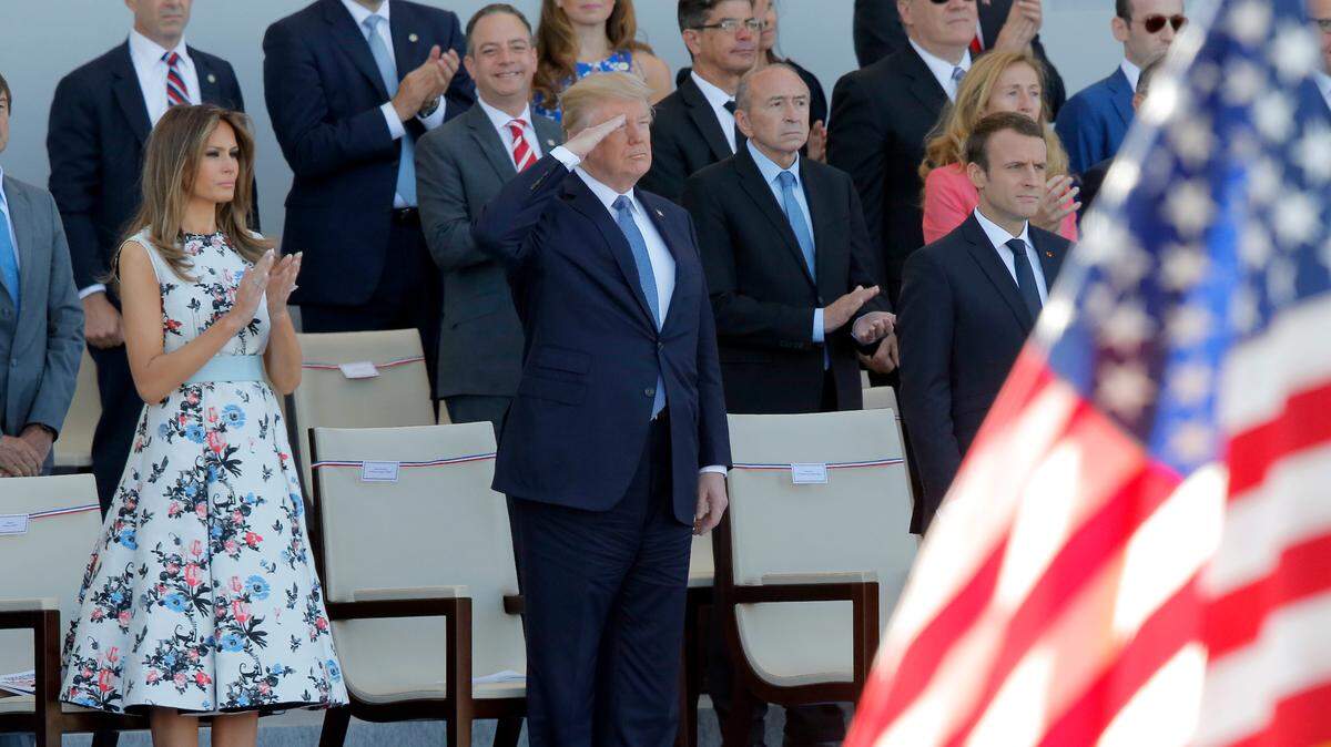 House-Senate conferees working out differences in the defense authorization bill modified House language in support of President Donald Trump’s call for a military parade in Washington. The president said he got the idea for a parade after watching a Bastille Day event with French President Emmanuel Macron, right, in Paris in 2017.