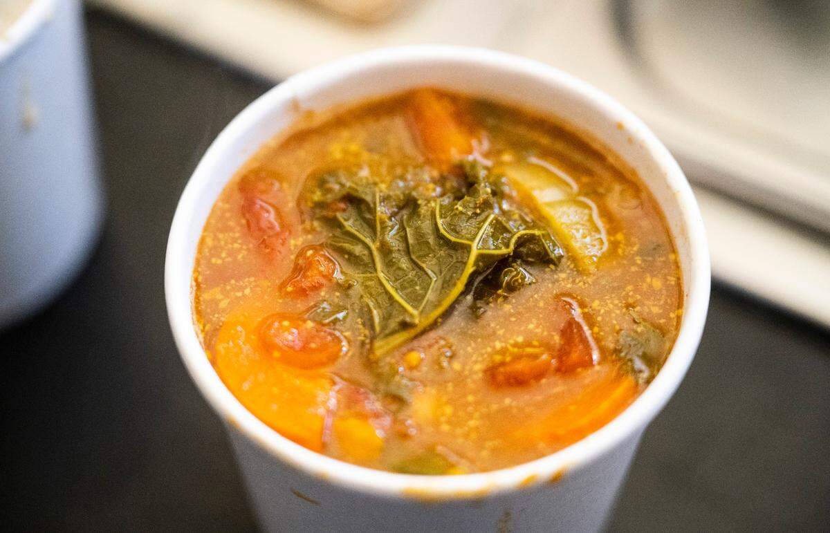 A fresh cup of Infinite Soups’ curried autumn vegetable soup sits on a counter at the restaurant in Tacoma on Nov. 9, 2022. 