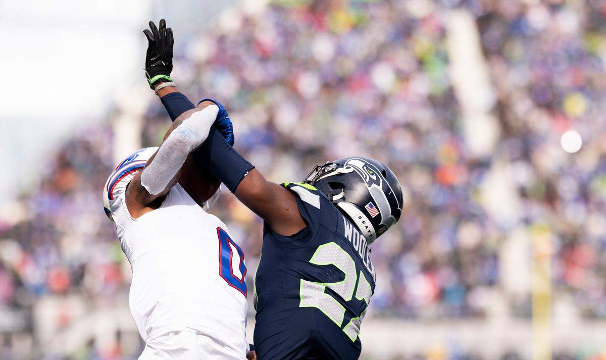 Buffalo Bills wide receiver Keon Coleman (0) catches a touchdown against Seattle Seahawks cornerback Riq Woolen (27) during the first quarter of the game at Lumen Field, on Sunday, Oct. 27, 2024 in Seattle, Wash.