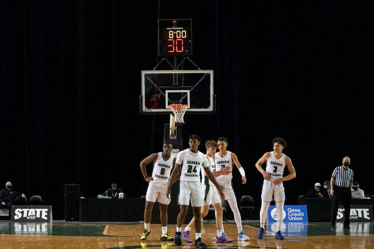 Auburn players take the court at the start of the second quarter of a Class 3A semifinal state tournament game against Seattle Prep on Friday, March 4, 2022, at the Tacoma Dome, in Tacoma, Wash.