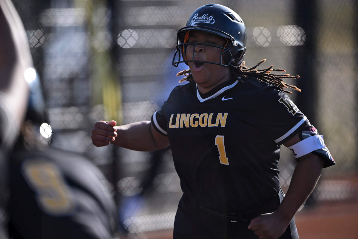 Lincoln’s Joy Wilde celebrates her three-run home run against Lakes during the game at Lincoln High School, on Tuesday, April 30, 2024, in Tacoma, Wash.