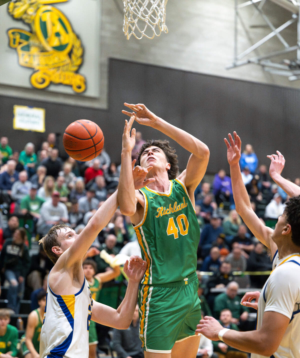Richland’s Lucas Westerfield (40) is fouled by Tahoma’s Adam Davis (22) during the 4A state regional boys game at Auburn Senior High School, on Saturday, Feb. 24, 2024 in Auburn, Washington.