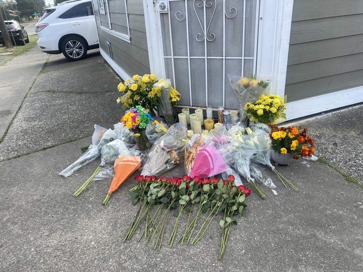 Community members left flowers at the door of The Little Store to honor the store’s owner who was shot and killed on Tuesday, October 4, 2023.