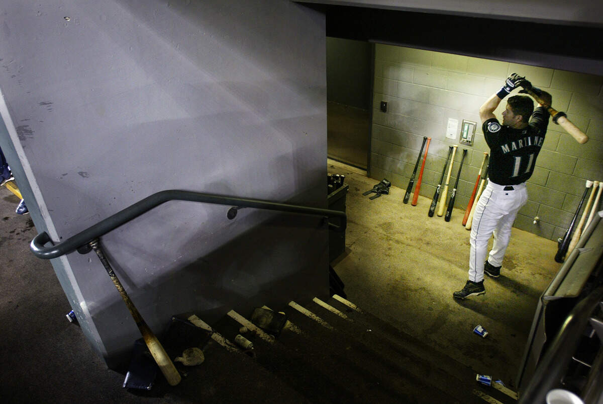 ** ADVANCE FOR WEEKEND EDITIONS SEPT. 25-26 ** Seattle Mariners designated hitter Edgar Martinez warms up with a weighted bat at the bottom of the dugout stairs at Safeco Field Friday, Sept. 17, 2004 during a game against the Oakland Athletics at Safeco Field in Seattle. The first weekend in October, the beloved 41-year-old seven-time All-Star, will play his last game in the majors, a retirement that is sure to re-ignite the debate as to whether there’s a place in Cooperstown for a career designated hitter. (AP Photo/Ted S. Warren)