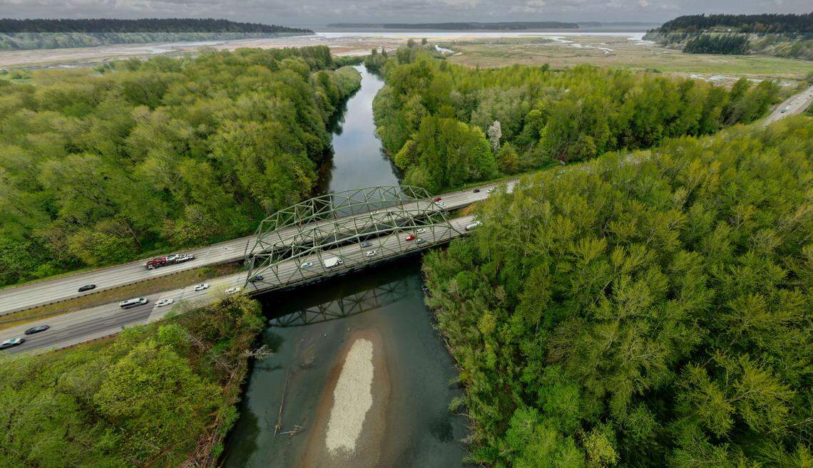 Reports suggest that fill of concrete, rocks and dirt underneath Interstate 5 where it flanks the Nisqually River bridges acts as a chokepoint, altering the course of the river, endangering salmon runs and increasing the threat of a catastrophic flood.