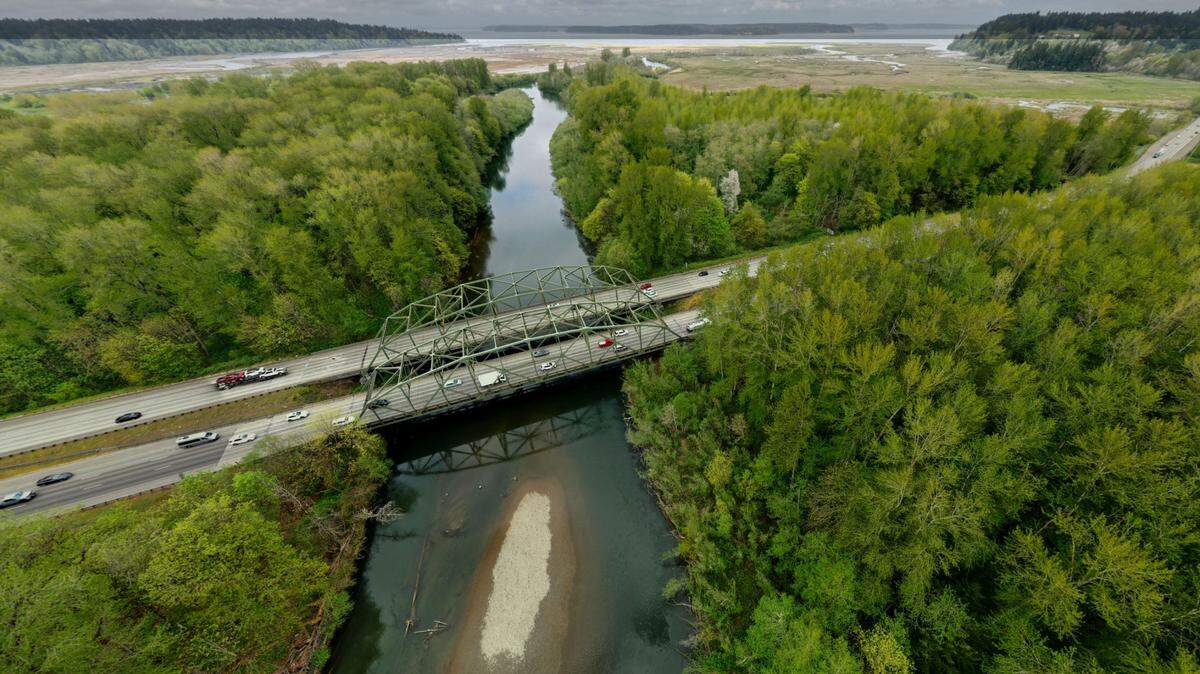 Reports suggest that fill of concrete, rocks and dirt underneath Interstate 5 where it flanks the Nisqually River bridges acts as a chokepoint, altering the course of the river, endangering salmon runs and increasing the threat of a catastrophic flood.