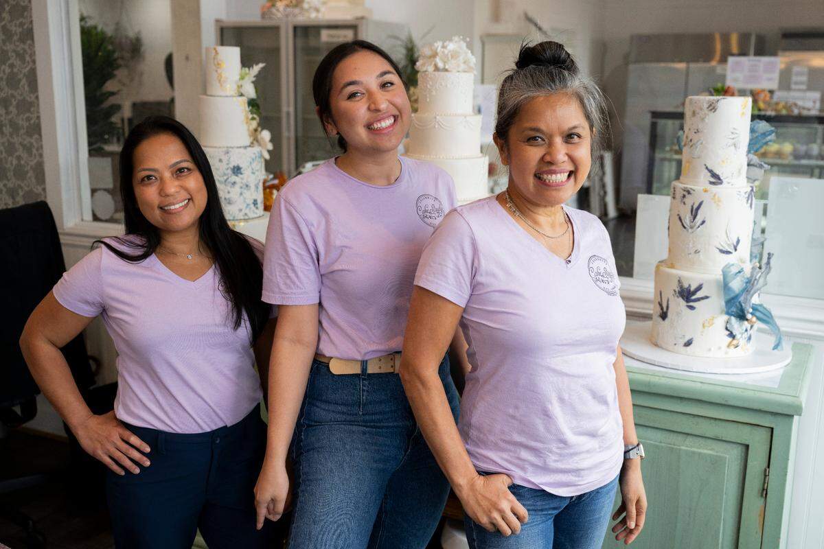 Celebrity Cake Studio celebrated 25 years in business this fall. Co-owners Mary Ann Quitugua (left) and Odette D’Aniello (right) are now joined by Odette’s daughter, Milana, shown here at the bakery on Tuesday, Oct. 15.