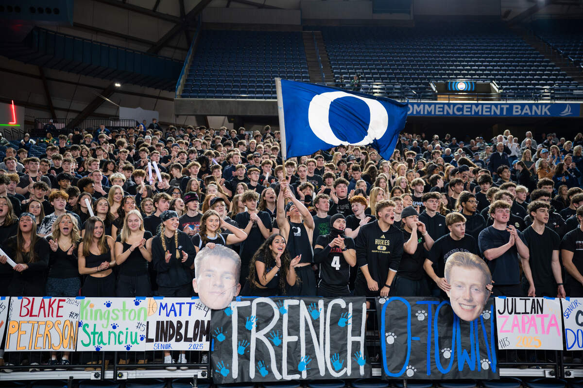 Olmypia sutdent section cheers before the first half of a Class 4A state basketball tournament first-round game between Olmypia and Auburn at the Tacoma Dome on Wednesday, March 5, 2025, in Tacoma, Wash.