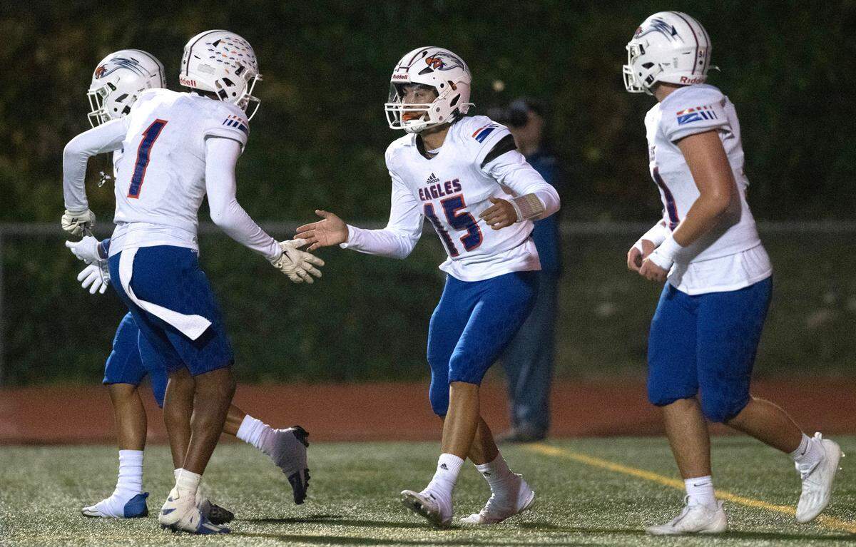 Graham Kapowsin quarterback Daveon Superales celebrates his touchdown run with wide receiver Malachi Durant (1) during Friday night’s 4A SPSL football game against the Curtis Vikings at Viking Stadium in University Place, Washington, on Oct. 6, 2023. Graham Kapowsin won the game, 42-35.