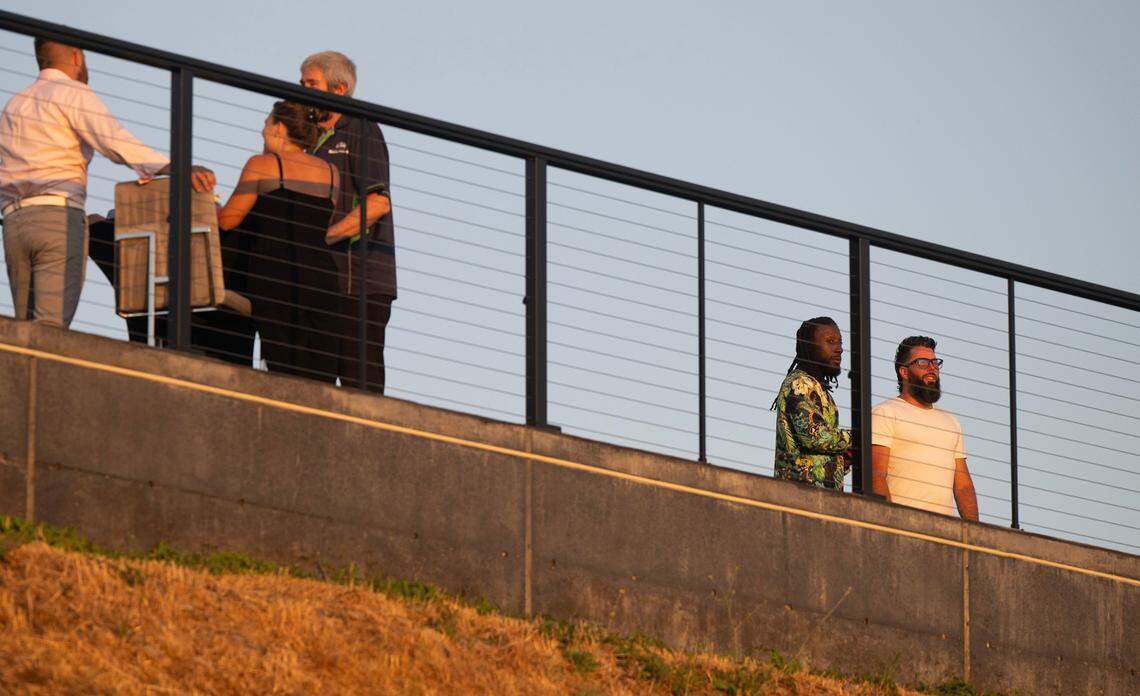 Tacoma local and former NFL football player Desmond Trufant (second from right) owns and operates The Sunset Estate on the west slope of Tacoma, shown during an charity event on Saturday, July 13, 2024. The luxurious home is advertised for overnight stays, but neighbors say it is used as an event center or “party house.”