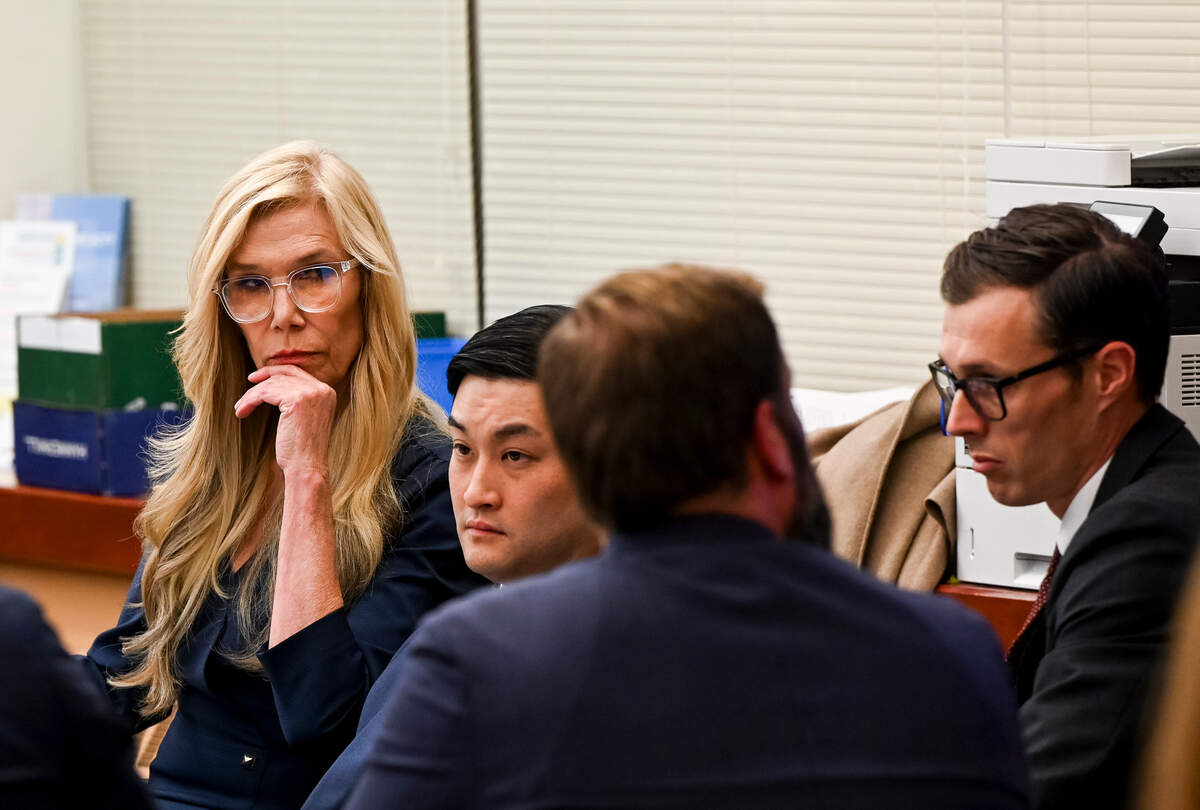 Defense attorney Anne Bremner and her client Timothy Rankine (left-center) watch as a video compilation plays during the trial of three Tacoma Police officers in the killing of Manny Ellis at Pierce County Superior Court, Monday, Nov. 27, 2023, in Tacoma, Wash. Tacoma Police Officers Christopher Burbank, Matthew Collins and Timothy Rankine stand trial for charges related to the March 2020 killing of Manny Ellis. (Brian Hayes / Pool Photo – The News Tribune)
