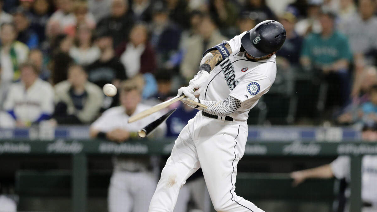 Seattle Mariners’ J.P. Crawford breaks his bat on an RBI single against the Minnesota Twins during the fifth inning of a baseball game Saturday, May 18, 2019, in Seattle.