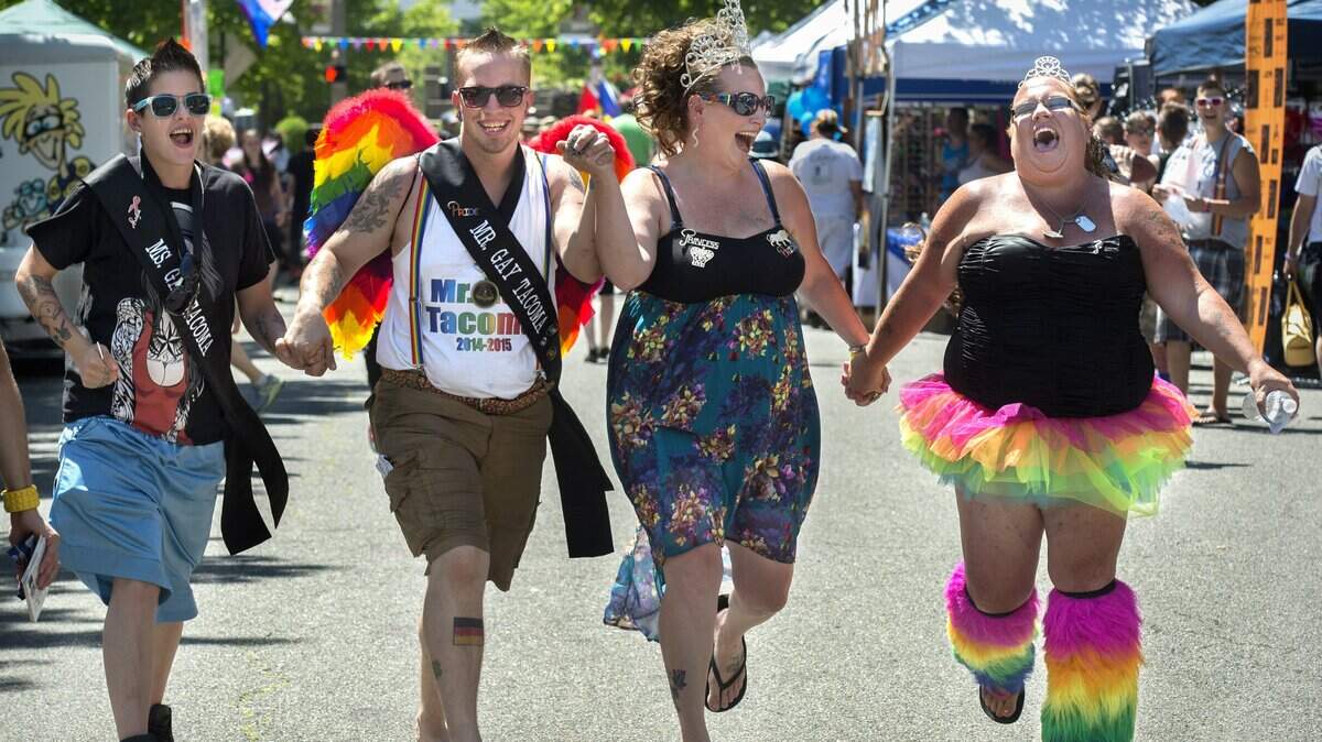 Celebrants are shown here enjoying the Tacoma Pride Festival on July 12, 2014. Organizers of this year’s event say recent hate messages posted around town will serve as a call to action for them and immigrant rights activists.
