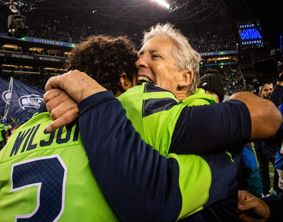 Seattle Seahawks head coach Pete Carroll and Seattle Seahawks quarterback Russell Wilson (3) celebrate after the game. The Seattle Seahawks played the Minnesota Vikings in a NFL football game at CenturyLink Field in Seattle, Wash., on Monday, Dec. 2, 2019.