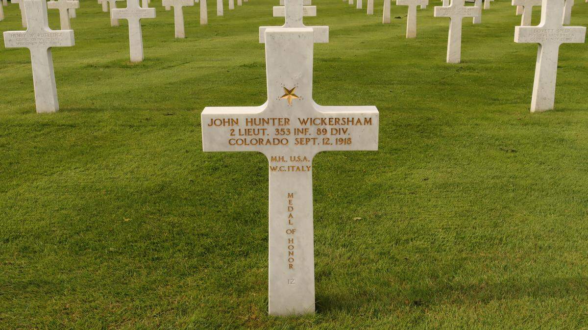 The grave of 2nd Lt. John Hunter Wickersham, a Congressional Medal of Honor service member, is photographed by Lynn Goralski at the St. Mihiel American Cemetery and Memorial in France on Monday, June 23, 2025.