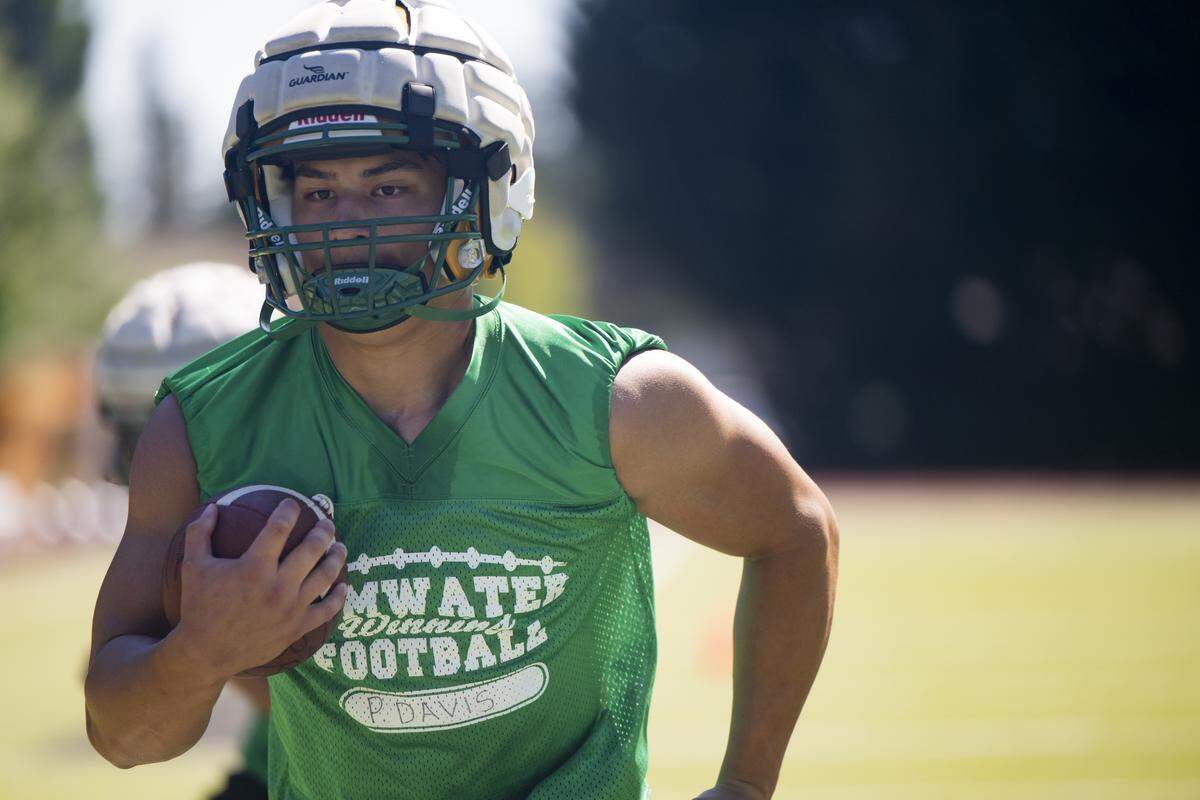 Tumwater running back Peyton Davis runs drills during a football practice at Tumwater High School on Friday, Aug. 22, 2025, in Tumwater, Wash.