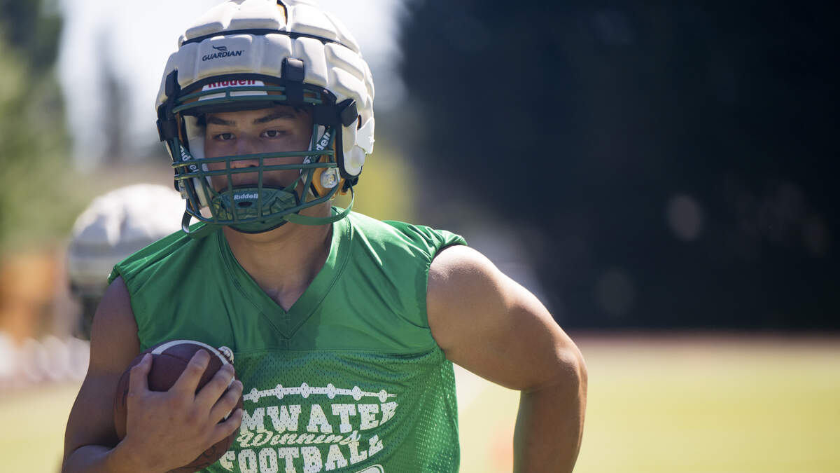 Tumwater running back Peyton Davis runs drills during a football practice at Tumwater High School on Friday, Aug. 22, 2025, in Tumwater, Wash.