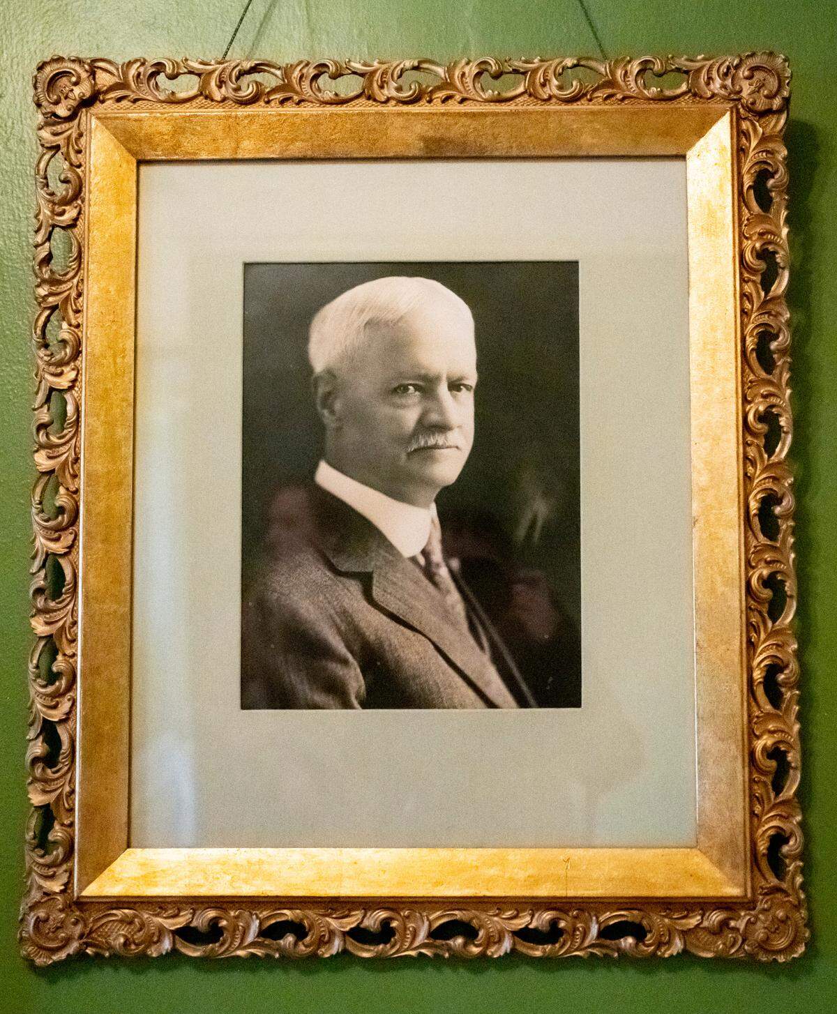 A portrait of William Rust, the President of the Tacoma Smelter and Refining Company and founder of Ruston, hangs on a wall on the second floor of the original Rust Mansion that was built in 1905, in Tacoma, Wash. on Dec. 6, 2022. The mansion has been renovated by real estate developer Ashley Burks, who purchased the property in December 2021.