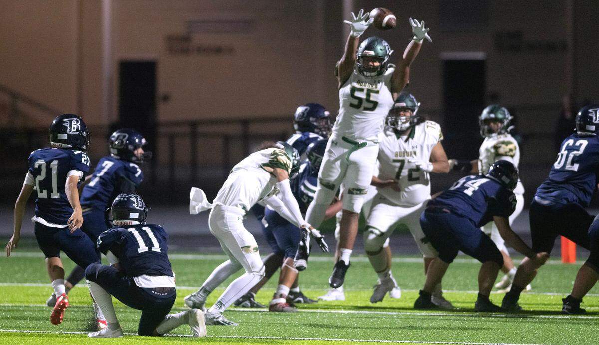 Auburn defensive lineman Fale Titiali blocks an extra point attempt by Todd Beamer kicker Bryson Cannon during Thursday night’s 3A NPSL football game at Federal Way Memorial Stadium in Federal Way, Washington, Oct. 19, 2023. Auburn won the game, 44-33.