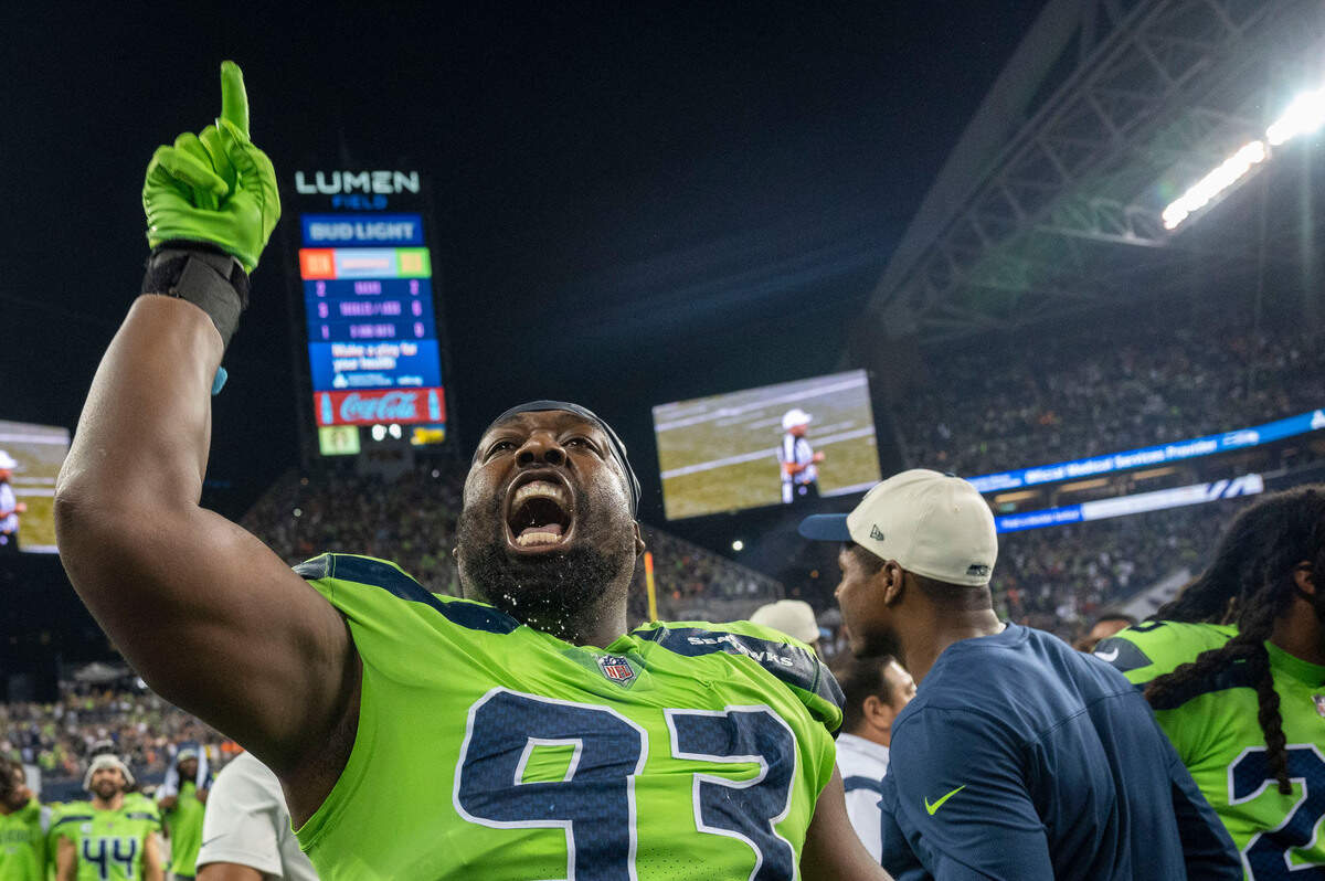 Seattle defensive end Shelby Harris (93) celebrates after the Seahawks sealed a 17-16 win against the Denver Broncos on Monday, Sept. 12, 2022, at Lumen Field in Seattle.