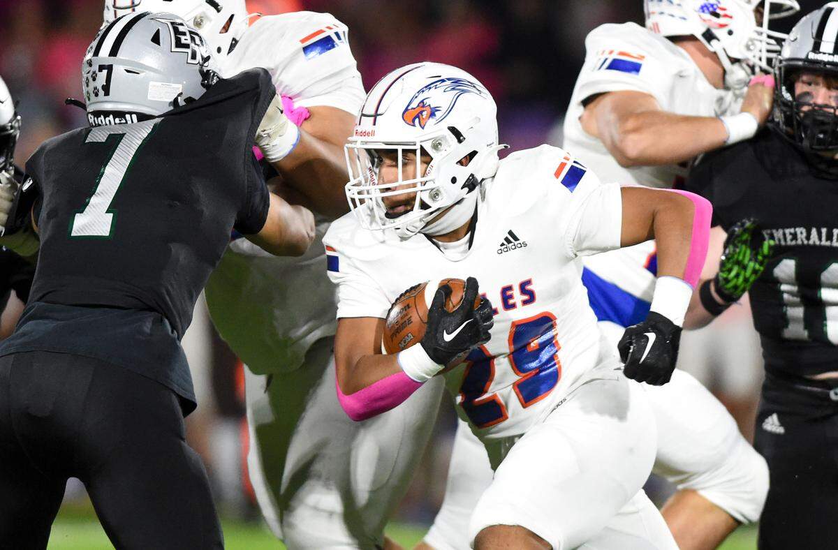 Graham-Kapowsin’s Alele Fa’apito-leao (29) carries the ball against Emerald Ridge during the first half of the game at Sparks Stadium, Saturday, Oct. 21, 2023, in Puyallup, Wash.