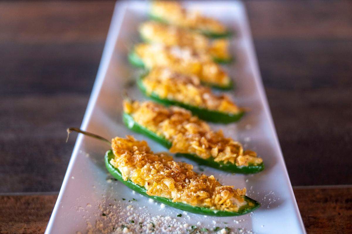 Without a deep fryer, Thirsty Hound Drinkery, located at 1905 Bridgeport Way in University Place, Wash., offers a menu of clever pub food including baked jalapeno poppers with a potato-chip crumb.