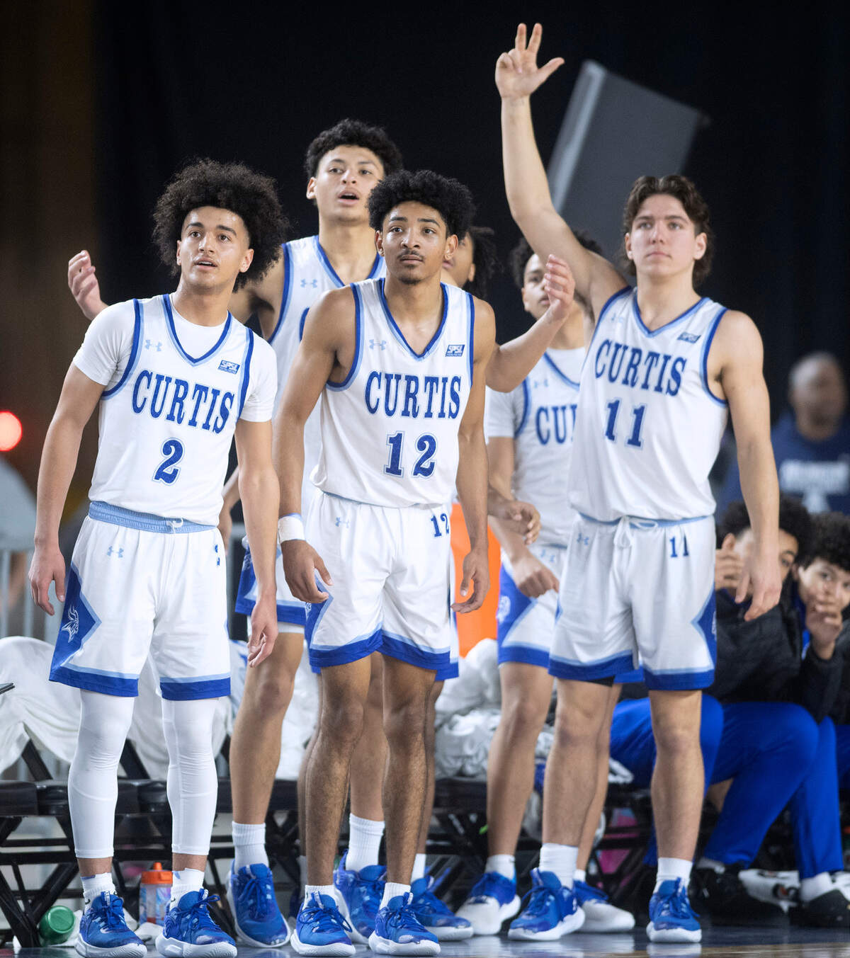 Curtis’ Bilal El Ghalemi (2), Cinque Maxwell (12) and Rocco Koch celebrate during their state quarterfinal game against the Camas Papermakers at the WIAA state basketball tournament in the Tacoma Dome in Tacoma, Washington, on Wednesday, March 1, 2023. Curtis won the game, 73-46