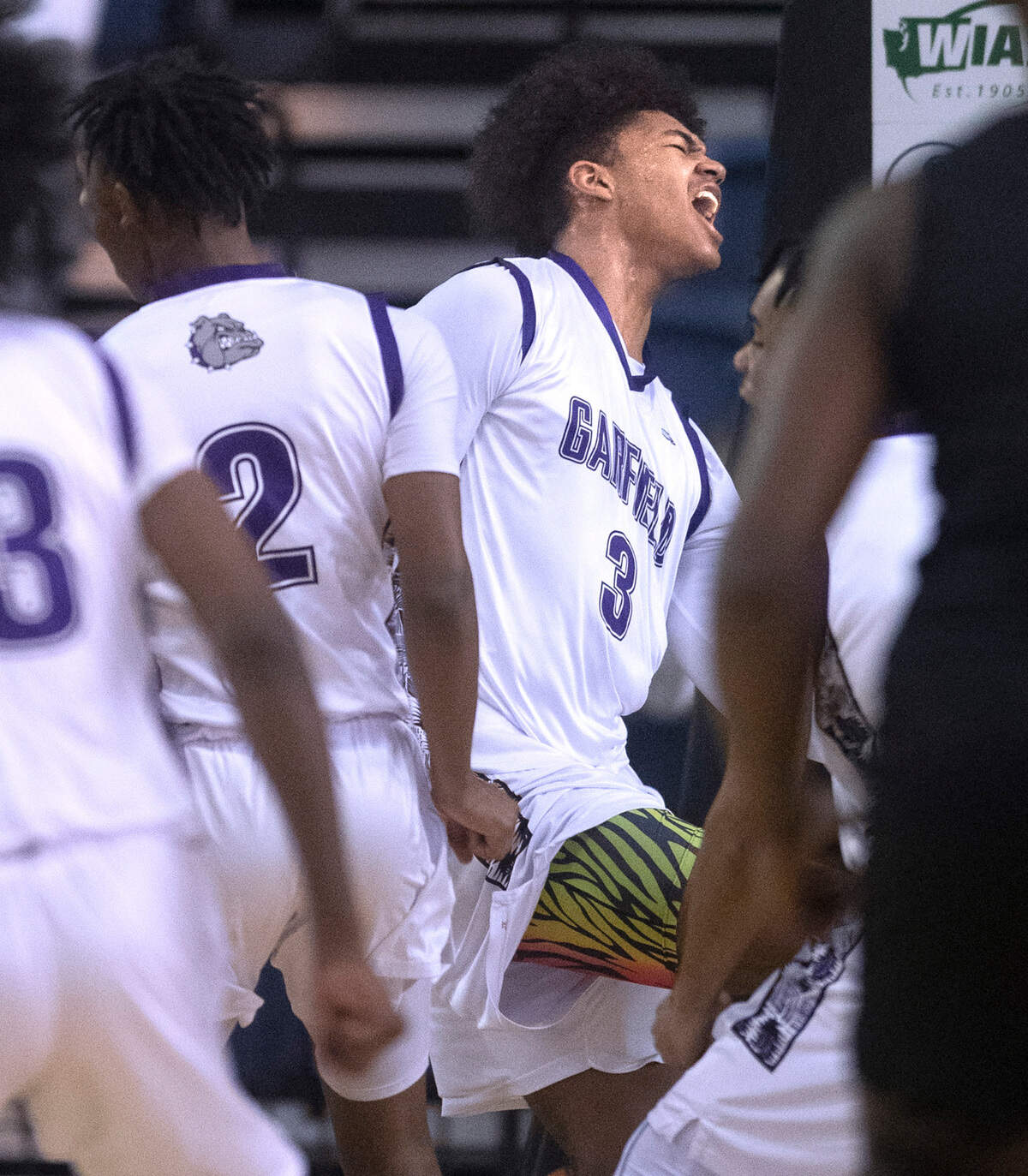 Garfield’s Jaylin Stewart lets out a roar after scoing on the Auburn Trojans during Thursday morning’s quarterfinal game of the WIAA 3A Boys Basketball State Championships tournament in the Tacoma Dome in Tacoma, Washington, on Thursday, March 3, 2022. Auburn won in overtime, 64-60.