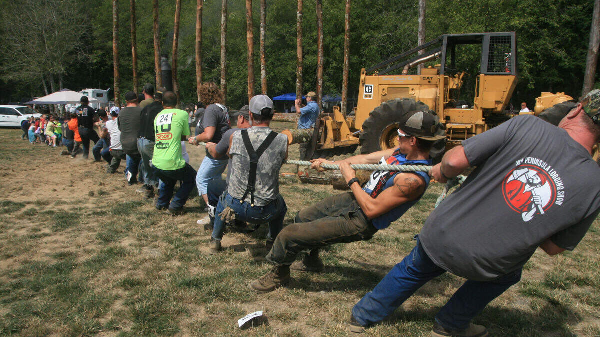 A tug of war pitted 36 youngsters, some of kindergarten age, against a collection of tough, burly adult loggers. The kids won!