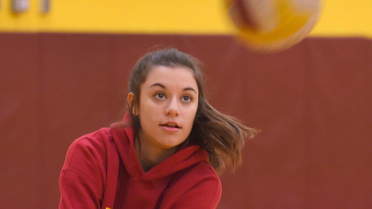 Capital’s Devyn Oestreich returns a practice service during the Cougars’ Nov. 19th practice as they prepare for the state tournament this weekend.
