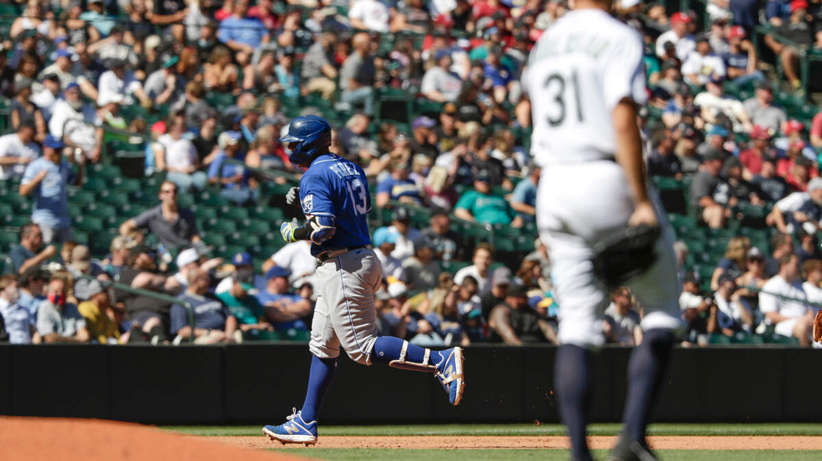 Kansas City Royals’ Salvador Perez rounds third after hitting a two-run home run as Seattle Mariners starting pitcher Tyler Anderson looks on during the fifth inning of a baseball game Saturday, Aug. 28, 2021, in Seattle. (AP Photo/Jason Redmond)
