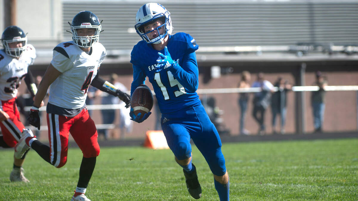 Eatonville wide receiver Job Kralik breaks loose for a touchdown reception in front of Tenino linebacker Gavin Watson and defensive back Lucas Watterson (4) during Saturday’s 1A Evergreen football game at Eatonville High School on Oct. 2, 2021. Eatonville won the game, 24-22.
